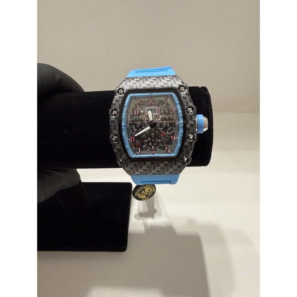 AJ Gold Tonneau Chronograph Wristwatch Blue Silicone Band Black Skeleton Dial